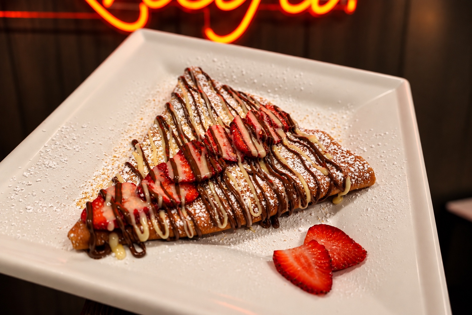 Strawberry crepe with chocolate drizzle