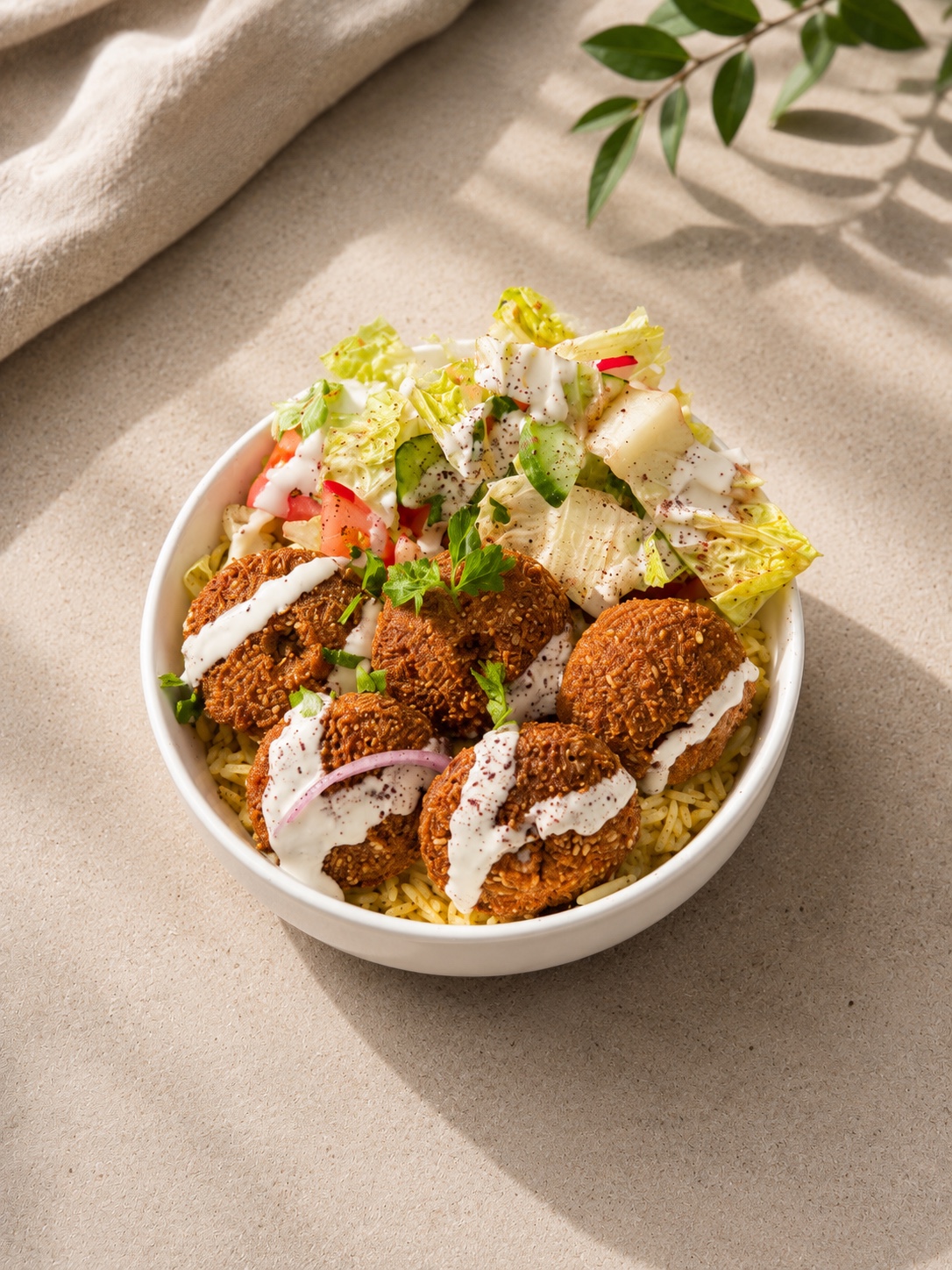 Falafel rice bowl with fresh salad